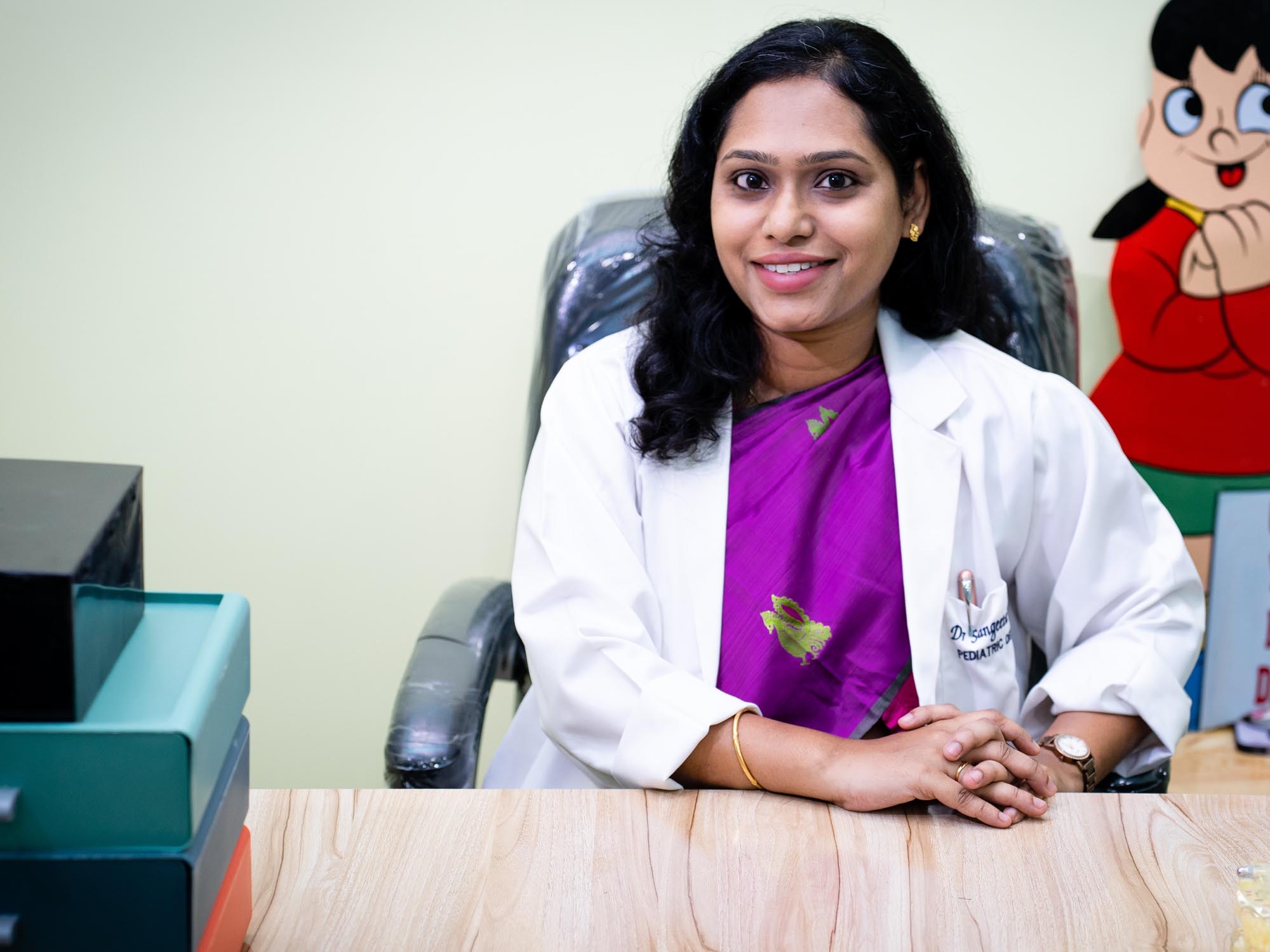Dr.Sangeeta Teleti on her desk with a welcoming smile